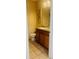 Neutral bathroom features tile floors, a wooden vanity with a granite counter, and an artful decoration at 561 Telfair Square Ct, Sanford, FL 32771