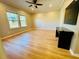 Bright bedroom with wood-look floors, ceiling fan, and two windows at 561 Telfair Square Ct, Sanford, FL 32771