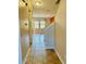 Hallway with tile floor leading to dining room and staircase at 561 Telfair Square Ct, Sanford, FL 32771