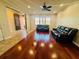 Inviting living room featuring hardwood floors and comfortable leather sofas at 561 Telfair Square Ct, Sanford, FL 32771