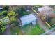 Aerial view of a charming home with a spacious yard and mature trees at 630 Carpenter Rd, Orlando, FL 32833