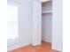 Bright bedroom features a closet, window, and flooring at 630 Carpenter Rd, Orlando, FL 32833