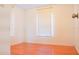 Bright bedroom featuring laminate floors and natural light streaming through the window at 630 Carpenter Rd, Orlando, FL 32833