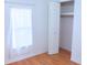 Bedroom with wood floors, closet and window at 630 Carpenter Rd, Orlando, FL 32833