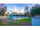 Cozy single-story home boasting a long porch, expansive yard, and storage shed at 630 Carpenter Rd, Orlando, FL 32833