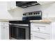 Kitchen featuring stainless steel range and hood at 630 Carpenter Rd, Orlando, FL 32833