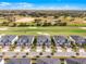 A detailed aerial view shows modern townhomes with manicured lawns and a lush green golf course at 635 Ocean Course Ave # 635, Champions Gate, FL 33896