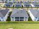 Aerial view of the community features screened balconies, black fences, and proximity to amenities at 635 Ocean Course Ave # 635, Champions Gate, FL 33896