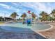 This shot showcases a vibrant splash pad area with water features, seating, and palm trees in a recreational space at 635 Ocean Course Ave # 635, Champions Gate, FL 33896