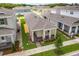 Aerial view of a single story home with well manicured lawn and landscaping, surrounded by similar homes in a planned community at 652 Kimber Ln, Debary, FL 32713