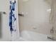 Bathroom with a tub/shower combo and a blue flower themed shower curtain at 8031 Enchantment Dr # Ge, Windermere, FL 34786