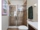 Bathroom with a toilet and fully tiled glass-door shower at 8031 Enchantment Dr # Ge, Windermere, FL 34786