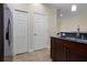 Well-lit kitchen showing cabinet space and granite countertops, plus a stainless steel refrigerator at 8031 Enchantment Dr # Ge, Windermere, FL 34786