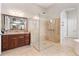 Modern bathroom featuring a glass-enclosed shower, granite counters, and vanity at 8774 Bayview Crossing Dr, Winter Garden, FL 34787