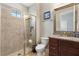 Bathroom features glass shower, neutral tile, and a granite topped vanity at 8774 Bayview Crossing Dr, Winter Garden, FL 34787