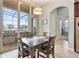 Bright dining area with sliding glass doors leading to an outdoor grill area at 8774 Bayview Crossing Dr, Winter Garden, FL 34787