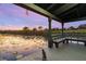 Scenic dock overlooking a tranquil pond, complete with a seating area to enjoy the serene water views at 8774 Bayview Crossing Dr, Winter Garden, FL 34787