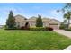 Beautiful single-story home with a well-manicured lawn and mature landscaping at 8774 Bayview Crossing Dr, Winter Garden, FL 34787