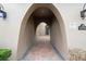 Covered walkway leading to the front door with brick pavers and sconce lighting at 8774 Bayview Crossing Dr, Winter Garden, FL 34787