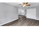 Bright bedroom featuring wood-look flooring, ceiling fan and a closet at 912 Enterprise Ave, New Smyrna Beach, FL 32168