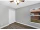 This bedroom features wood-look flooring, a closet and a window with outside view at 912 Enterprise Ave, New Smyrna Beach, FL 32168