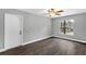 Bright bedroom with a ceiling fan, and wood-look flooring at 912 Enterprise Ave, New Smyrna Beach, FL 32168