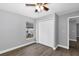 Bedroom features large window and closet, accented by a modern ceiling fan at 912 Enterprise Ave, New Smyrna Beach, FL 32168