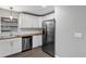 Modern kitchen features stainless steel appliances, white cabinetry, and butcher block countertops at 912 Enterprise Ave, New Smyrna Beach, FL 32168