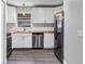 Updated kitchen featuring stainless steel appliances, white cabinets, and butcher block counters at 912 Enterprise Ave, New Smyrna Beach, FL 32168