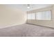 Bright bedroom featuring carpet, a ceiling fan, and two windows with bright natural light at 95 Carolwood Blvd, Fern Park, FL 32730