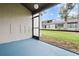 Screened-in patio with blue flooring and an expansive view of the yard at 95 Carolwood Blvd, Fern Park, FL 32730