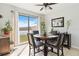 Dining area featuring a modern ceiling fan, tile floors, and sliding glass doors to the outside at 3446 Allegra Cir, St Cloud, FL 34772