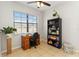 Home office featuring a wooden desk, bookcase, and a large window offering natural light at 3446 Allegra Cir, St Cloud, FL 34772