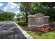 Community sign for Fire Creek at Gotha, with manicured landscaping at 10055 Brocksport Cir, Gotha, FL 34734