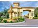 Community entrance with stone fountain and archway at entry to neighborhood at 1183 Chervil Dr, Poinciana, FL 34759