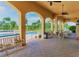 Poolside veranda with arched supports and tiled flooring near the pool at 1183 Chervil Dr, Poinciana, FL 34759