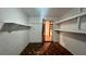 Unfinished basement featuring open shelving, ceramic tile floor, and white painted walls at 1201 S Oxalis Ave, Orlando, FL 32807