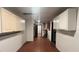 Basement area featuring red tile flooring, utility connections and painted block walls at 1201 S Oxalis Ave, Orlando, FL 32807