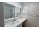 Bathroom featuring a sink, mirror, and shower stall at 1201 S Oxalis Ave, Orlando, FL 32807