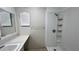 Bathroom featuring a sink, mirror, and shower stall at 1201 S Oxalis Ave, Orlando, FL 32807