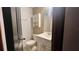 Bathroom features a toilet, sink, mirror, and shower stall at 1201 S Oxalis Ave, Orlando, FL 32807