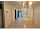 Spacious living room area featuring tile flooring and a ceiling fan with great natural light at 1201 S Oxalis Ave, Orlando, FL 32807