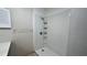 Bathroom features a shower with shelves at 1201 S Oxalis Ave, Orlando, FL 32807