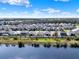 Scenic aerial view of community homes, showcasing the community's proximity to tranquil lake at 1204 Pando Loop, Orlando, FL 32824