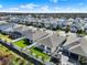 Aerial view of a neighborhood showcasing manicured lawns and houses at 1204 Pando Loop, Orlando, FL 32824