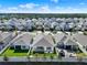 Aerial view of a neighborhood showcasing manicured lawns and houses at 1204 Pando Loop, Orlando, FL 32824