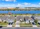 Aerial view of a neighborhood located on a waterfront with commercial buildings at 1204 Pando Loop, Orlando, FL 32824