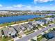 Scenic aerial view of neighborhood homes with lake showcasing the community's beautiful landscaping at 1204 Pando Loop, Orlando, FL 32824