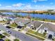 Aerial view of a neighborhood located on a waterfront with commercial buildings at 1204 Pando Loop, Orlando, FL 32824