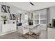 Elegant dining area featuring a white table, chic decor, modern lighting, and large windows at 1204 Pando Loop, Orlando, FL 32824